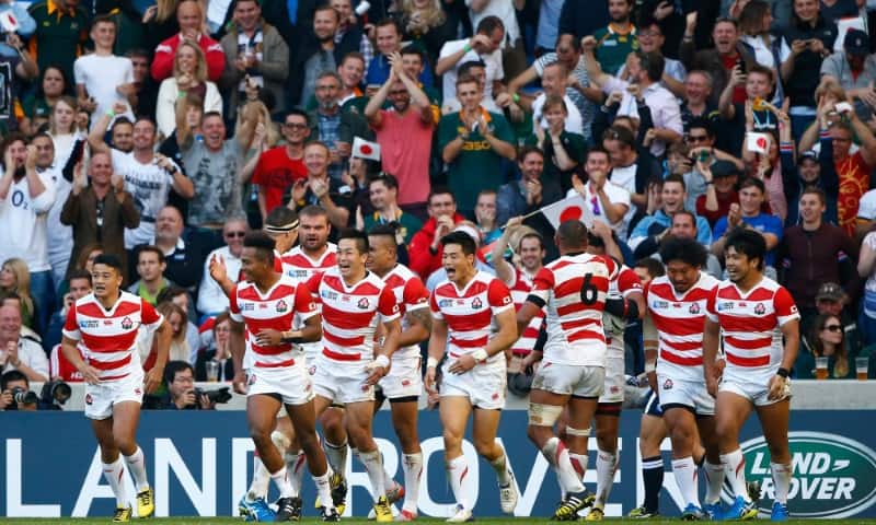 BRIGHTON, ENGLAND - SEPTEMBER 19: Japan players celebrate the try of Ayumu Goromaru of Japan during the 2015 Rugby World Cup Pool B match between South Africa and Japan at the Brighton Community Stadium on September 19, 2015 in Brighton, United Kingdom. (Photo by Julian Finney/Getty Images)